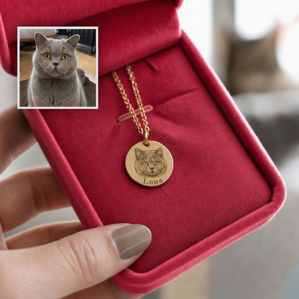 Luna the cat engraved on a gold charm in the red gift box